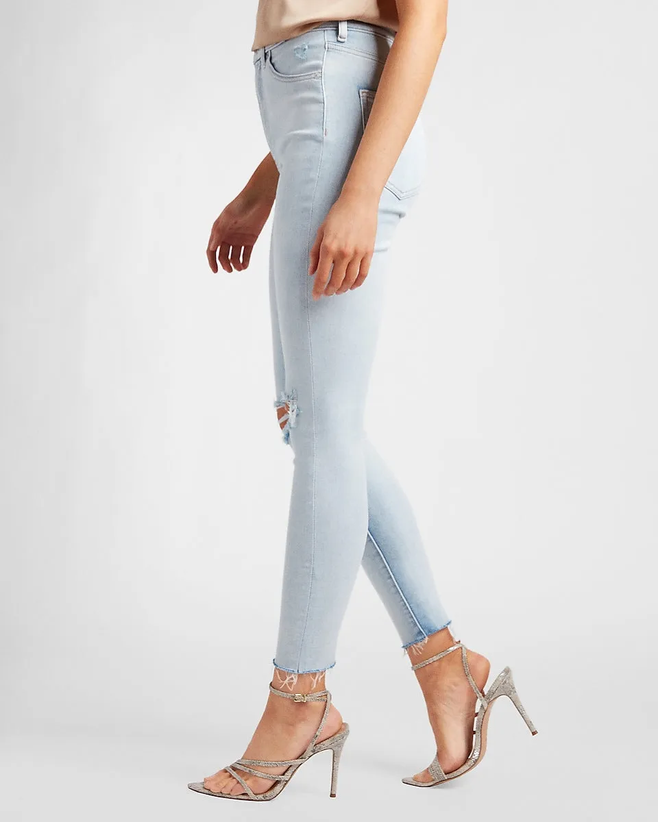 Super High Waisted Ripped Raw Hem Skinny Jeans in Medium Wash
